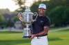 Aaron Rai, of England, holds the Wanamaker Trophy after winning the PGA Championship golf tournament at Aronimink Golf Club, Sunday, May 17, 2026, in Newtown Square, PA. (AP Photo/Matt Slocum)