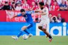 Real Madrid's Dani Carvajal, left, duels for the ball with Sevilla's Chidera Ejuke during the Spanish La Liga soccer match in Seville, Spain, Sunday, May 17, 2026. (AP Photo/Jose Breton)