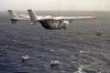 FILE - A Brothers to the Rescue plane flies over The Democracy Movement flotilla at the twelve-mile limit north of Havana, Cuba, July 10, 1999. (AP Photo/Alan Diaz, File)