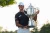 Aaron Rai, of England, holds the Wanamaker Trophy after winning the PGA Championship golf tournament at Aronimink Golf Club, Sunday, May 17, 2026, in Newtown Square, PA. (AP Photo/Frank Franklin II)