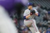 Texas Rangers starting pitcher MacKenzie Gore works against the Colorado Rockies in the first inning of a baseball game Monday, May 18, 2026, in Denver. (AP Photo/David Zalubowski)