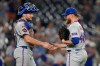 New York Mets catcher Hayden Senger, left, and pitcher Craig Kimbrel, right, celebrate after winning a baseball game against the Washington Nationals, Monday, May 18, 2026, in Washington. (AP Photo/Jess Rapfogel)