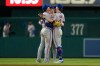 From left to right, New York Mets left fielder Tyrone Taylor, center fielder A.J. Ewing, and right fielder Carson Benge celebrate after winning a baseball game against the Washington Nationals, Monday, May 18, 2026, in Washington. (AP Photo/Jess Rapfogel)