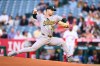 Athletics pitcher J.T. Ginn delivers during the first inning of a baseball game against the Los Angeles Angels, Monday, May 18, 2026, in Anaheim, Calif. (AP Photo/William Liang)