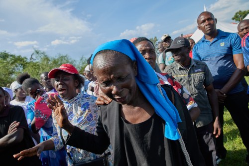 Professional mourners grieve alongside family members and friends of the deceased during a funeral on the outskirts of Kisumu, Kenya, Friday, March 13, 2026. (AP Photo/Asa Wallin)
