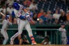 New York Mets' Marcus Semien hits an RBI single against the Washington Nationals during the twelfth inning of a baseball game, Monday, May 18, 2026, in Washington. (AP Photo/Jess Rapfogel)