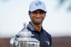 Aaron Rai, of England, looks past the Wanamaker Trophy after winning the PGA Championship golf tournament at Aronimink Golf Club, Sunday, May 17, 2026, in Newtown Square, PA. (AP Photo/Carolyn Kaster)