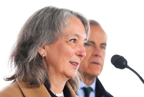 Environment and Climate Change Minister Julie Dabrusin, left, and Prime Minister Mark Carney take part in an announcement in Wakefield, Que., Tuesday, March 31, 2026. THE CANADIAN PRESS/Sean Kilpatrick