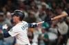 Seattle Mariners' Colt Emerson follows through on a three-run home run against the Chicago White Sox during the eighth inning of a baseball game, Monday, May 18, 2026, in Seattle. (AP Photo/Lindsey Wasson)