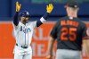 Tampa Bay Rays' Yandy Díaz, left, celebrates after his RBI double off Baltimore Orioles pitcher Kyle Bradish during the first inning of a baseball game Tuesday, May 19, 2026, in St. Petersburg, Fla. (AP Photo/Chris O'Meara)