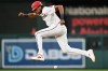 Washington Nationals' James Wood leaps a over a ground ball on his way to second base during the first inning of a baseball game against the New York Mets, Tuesday, May 19, 2026, in Washington. (AP Photo/John McDonnell)