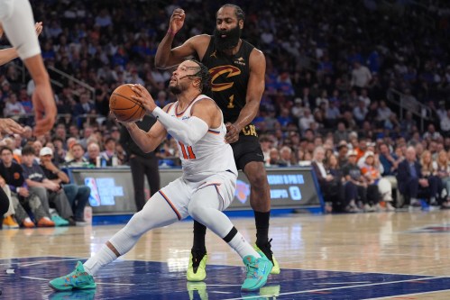New York Knicks' Jalen Brunson, bottom, drives past Cleveland Cavaliers' James Harden during the second half of Game 1 in the Eastern Conference finals NBA basketball playoffs series Tuesday, May 19, 2026, in New York. (AP Photo/Seth Wenig)