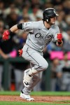 Chicago White Sox designated hitter Andrew Benintendi runs to first after hitting an RBI in the ninth inning of a baseball game against the Seattle Mariners, Tuesday, May 19, 2026, in Seattle. (AP Photo/Kevin Ng)