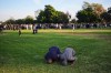 Two people pray during a vigil, the day after a shooting, outside of the Islamic Center of San Diego, Tuesday, May 19, 2026, in San Diego. (AP Photo/Jae C. Hong)