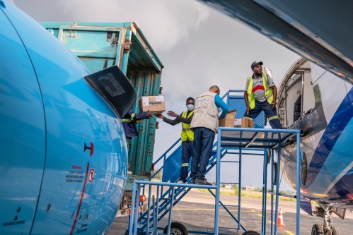 People off-load a shipment of more than 15 tons of supplies donated by UNICEF as part of the response to the Ebola virus outbreak at Bunia National Airport in Bunia, Congo, Tuesday, May 19, 2026. (AP Photo/Moses Sawasawa)