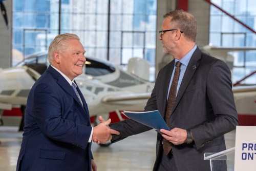 Ontario Premier Doug Ford shakes hands with Toronto Port Authority President and CEO RJ Steenstra at an event at Billy Bishop Toronto City Airport on Monday March 23, 2026. THE CANADIAN PRESS/Frank Gunn