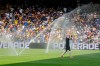 FILE - Auckland City's Gerard Garriga cools off under the sprinklers during a hydration break in the Club World Cup Group C soccer match between Auckland City and Boca Juniors in Nashville, Tenn., Tuesday, June 24, 2025. (AP Photo/George Walker IV, File)
