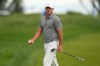 Brooks Koepka walks off the seventh green during the second round of the PGA Championship golf tournament at Aronimink Golf Club, Friday, May 15, 2026, in Newtown Square, PA. (AP Photo/Frank Franklin II)