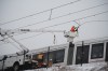 A worker repairs overhead wires on a stalled OC Transpo train near Lees Avenue station in Ottawa, on Friday, Jan. 6, 2023. THE CANADIAN PRESS/Spencer Colby