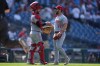 Cincinnati Reds catcher P.J. Higgins and pitcher Sam Moll celebrate their win after a baseball game against the Philadelphia Phillies, Wednesday, May 20, 2026, in Philadelphia. (AP Photo/Matt Rourke)