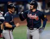 Atlanta Braves' Austin Riley, right, celebrates hitting a home run during the second inning of a baseball game, Wednesday, May 20, 2026, in Miami. (AP Photo/Michael Laughlin)