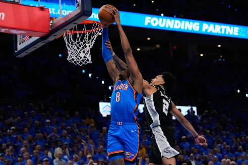 Oklahoma City Thunder guard Jalen Williams (8) shoots against San Antonio Spurs guard Dylan Harper (2) during overtime of Game 1 in a third-round NBA basketball playoffs series Monday, May 18, 2026, in Oklahoma City. (AP Photo/Tony Gutierrez)