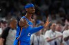 Oklahoma City Thunder guard Shai Gilgeous-Alexander celebrates after making a 3-pointer during the second half of Game 2 in the Western Conference finals NBA basketball playoffs series against the San Antonio Spurs Wednesday, May 20, 2026, in Oklahoma City. (AP Photo/Tony Gutierrez)