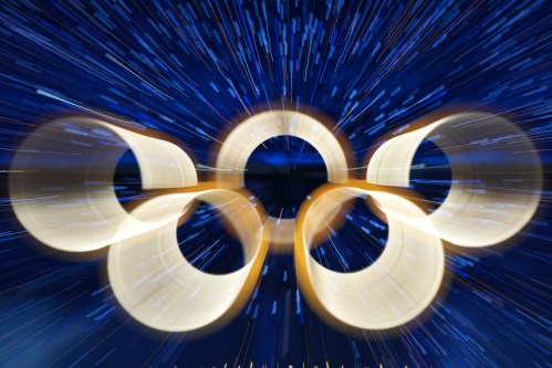 FILE - The Olympic rings are illuminated during the Olympic opening ceremony at the 2026 Winter Olympics, in Milan, Italy, Friday, Feb. 6, 2026. (AP Photo/Francisco Seco, File)