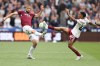 West Ham's Tomas Soucek, left, and Arsenal's Myles Lewis-Skelly fight for the ball during the Premier League soccer match between West Ham and Arsenal in London, Sunday, May 10, 2026. (AP Photo/Ian Walton)