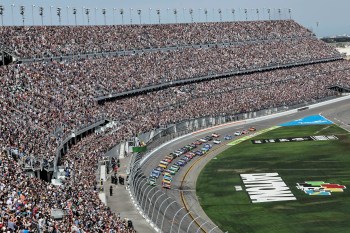 FILE - Cars move during the NASCAR Daytona 500 auto race at Daytona International Speedway, Feb. 15, 2026, in Daytona Beach, Fla. (AP Photo/David Graham, File)
