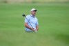 Scottie Scheffler watches his shot on the 14th hole during the first round of the Byron Nelson golf tournament in McKinney, Texas, Thursday, May 21, 2026. (AP Photo/LM Otero)