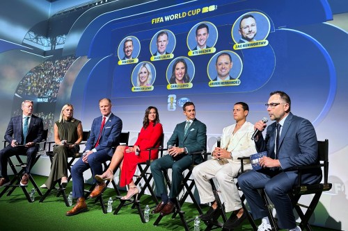 Fox Sports hosts, from left, Rob Stone and Rebecca Lowe, and former player/analysts Alexi Lalas, Stu Holden and Javier Hernandez listen as Fox Sports' vice president of production Zac Kenworthy speaks during a World Cup soccer new conference, Thursday, May 21, 2026, in New York. (AP Photo/Ronald Blum)