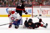 Montréal Canadiens' Nick Suzuki (14) collides with Carolina Hurricanes' Seth Jarvis (24) resulting in both getting penalties during the first period in Game 1 of the Eastern Conference finals NHL hockey Stanley Cup playoffs series in Raleigh, N.C., Thursday, May 21, 2026. (AP Photo/Karl DeBlaker)