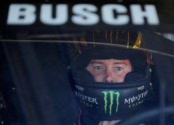 FILE - Kyle Busch waits in his car before practice for Sunday's NASCAR Sprint Cup series Coca-Cola 600 auto race at Charlotte Motor Speedway in Concord, N.C., Saturday, May 25, 2013. (AP Photo/Mike McCarn, File, File)