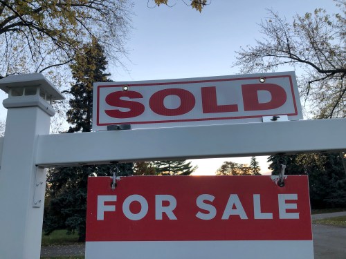 Real estate sale signage is shown on a street in Oakville, Ont., west of Toronto, on Thursday, Nov. 7, 2024. THE CANADIAN PRESS/Richard Buchan