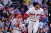Boston Red Sox's Trevor Story watches the flight of his solo home run during the second inning of a baseball game against the Philadelphia Phillies, Wednesday, May 13, 2026, in Boston. (AP Photo/Charles Krupa)