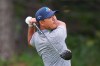 Si Woo Kim, of South Korea, watches his tee shot on the 14th hole during the first round of the Byron Nelson golf tournament in McKinney, Texas, Thursday, May 21, 2026. (AP Photo/LM Otero)
