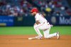 Los Angeles Angels' Yoán Moncada looks on after stealing second base during the fifth inning of a baseball game against the Athletics, Monday, May 18, 2026, in Anaheim, Calif. (AP Photo/William Liang)