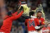 Atlanta Braves' Chadwick Tromp embraces Mauricio Dubón (14) after hitting the game-winning RBI-Single in the 11th inning of a baseball game against the Washington Nationals, Friday, May 22, 2026, in Atlanta. (AP Photo/Mike Stewart)