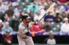 Arizona Diamondbacks' Lourdes Gurriel Jr. follows the flight of his double off Colorado Rockies starting pitcher Tomoyuki Sugano in the second inning of a baseball game Saturday, May 16, 2026, in Denver. (AP Photo/David Zalubowski)