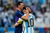 FILE - Argentina's head coach Lionel Scaloni kisses Argentina's Lionel Messi, right, at the end of the World Cup quarterfinal soccer match between the Netherlands and Argentina, at the Lusail Stadium in Lusail, Qatar, Dec. 10, 2022. (AP Photo/Natacha Pisarenko, File)