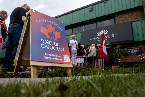 People take part in a Forever Canadian rally in Edmonton on Saturday, May 23, 2026. Former deputy premier and spokesperson for the Forever Canadian campaign, Thomas Lukaszuk, is kicking off a provincewide tour. THE CANADIAN PRESS/Amanda Erickson.