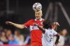 Chicago Fire defender Andrew Gutman, middle, heads the ball over Toronto FC midfielder Malik Henry during the second half of an MLS soccer match Saturday, May 23, 2026, in Chicago. (AP Photo/Melissa Tamez)