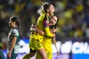 Irene Guerrero of Mexico's America, top, is congratulated after scoring her side's 4th goal against The United States' Washington Spirit during the Women's CONCACAF Champions Cup final soccer match in Pachuca, Mexico, Saturday, May 23, 2026.(AP Photo/Fernando Llano)