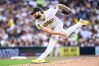San Diego Padres pitcher Lucas Giolito delivers during the second inning of a baseball game against the Athletics, Saturday, May 23, 2026, in San Diego. (AP Photo/William Liang)