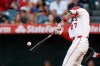 Los Angeles Angels' Mike Trout hits a two-run home run during the first inning of a baseball game against the Texas Rangers, Saturday, May 23, 2026, in Anaheim, Calif. (AP Photo/Caroline Brehman)