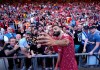 Liverpool's Mohamed Salah takes a selfie with fans following his final Liverpool appearance in the Premier League match at Anfield, Liverpool, England, Sunday May 24, 2026. (Peter Byrne/PA via AP)