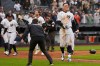 New York Yankees' Aaron Judge, right, reacts after hitting a two-run walk-off home run during the ninth inning of a baseball game against the Tampa Bay Rays, Sunday, May 24, 2026, in New York. (AP Photo/Seth Wenig)