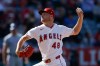 Los Angeles Angels starting pitcher Reid Detmers pitches during the first inning of a baseball game against the Texas Rangers, Sunday, May 24, 2026, in Anaheim, Calif. (AP Photo/Caroline Brehman)