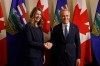 Prime Minister Mark Carney shakes hands with Alberta Premier Danielle Smith in Calgary, Friday, May 15, 2026. THE CANADIAN PRESS/Jeff McIntosh